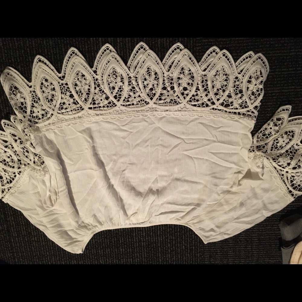 White off the shoulder shirt.